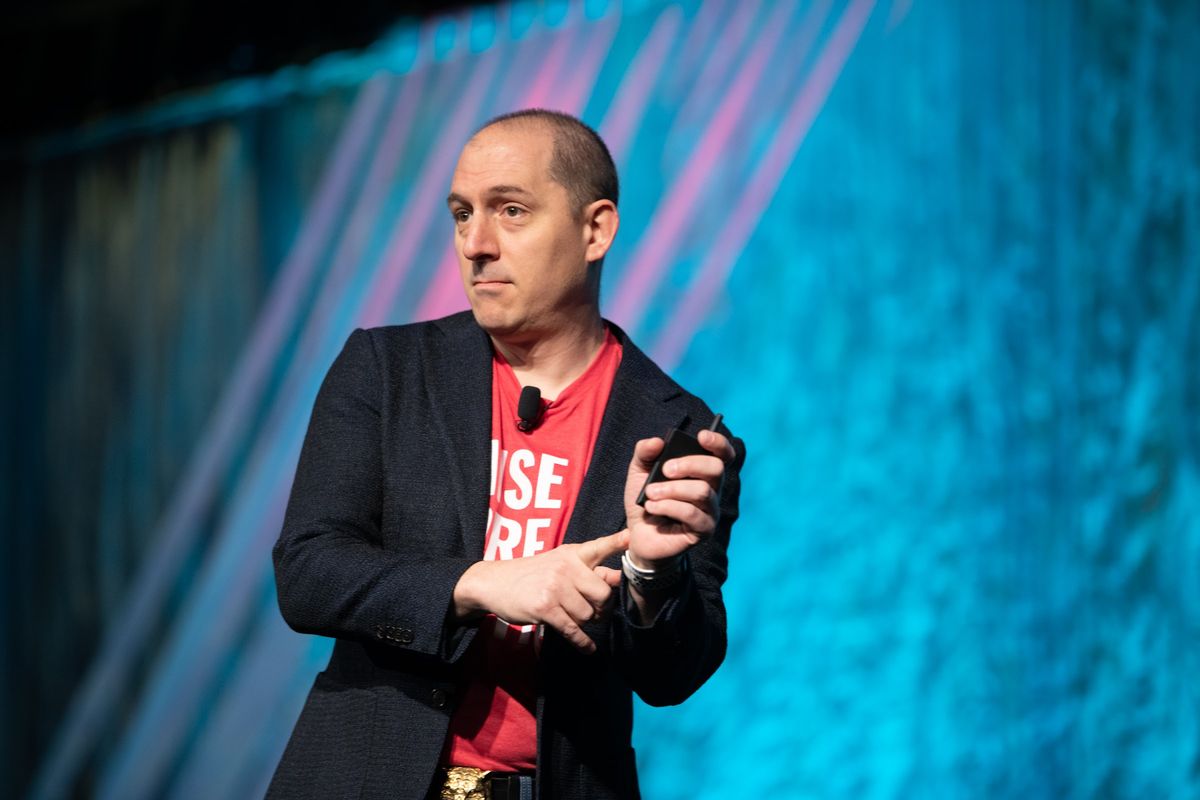 Steve Werner mid-talk with a microphone